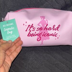 NWT OCS Pink Cosmetic Bag “it’s so hard being iconic” themed bag